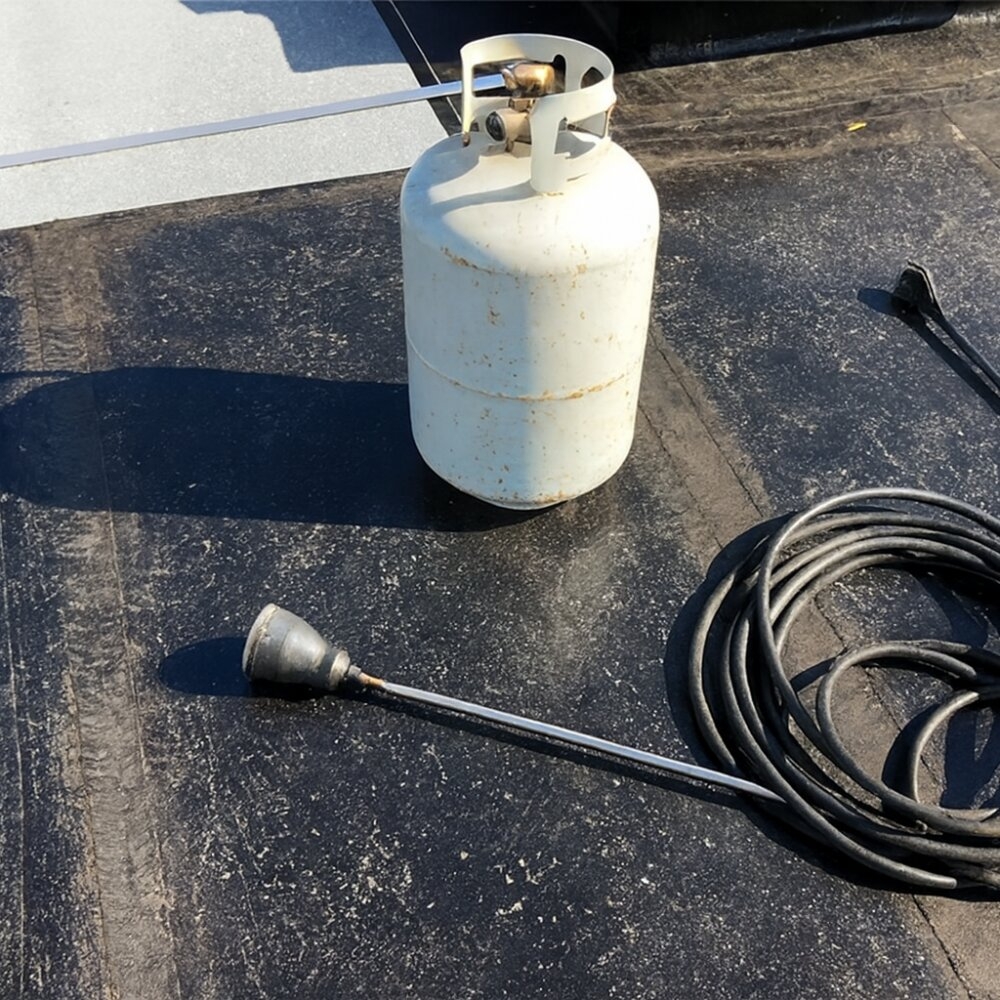 Propane cylinder and torch equipment used in construction demonstrating safe propane handling and training awareness