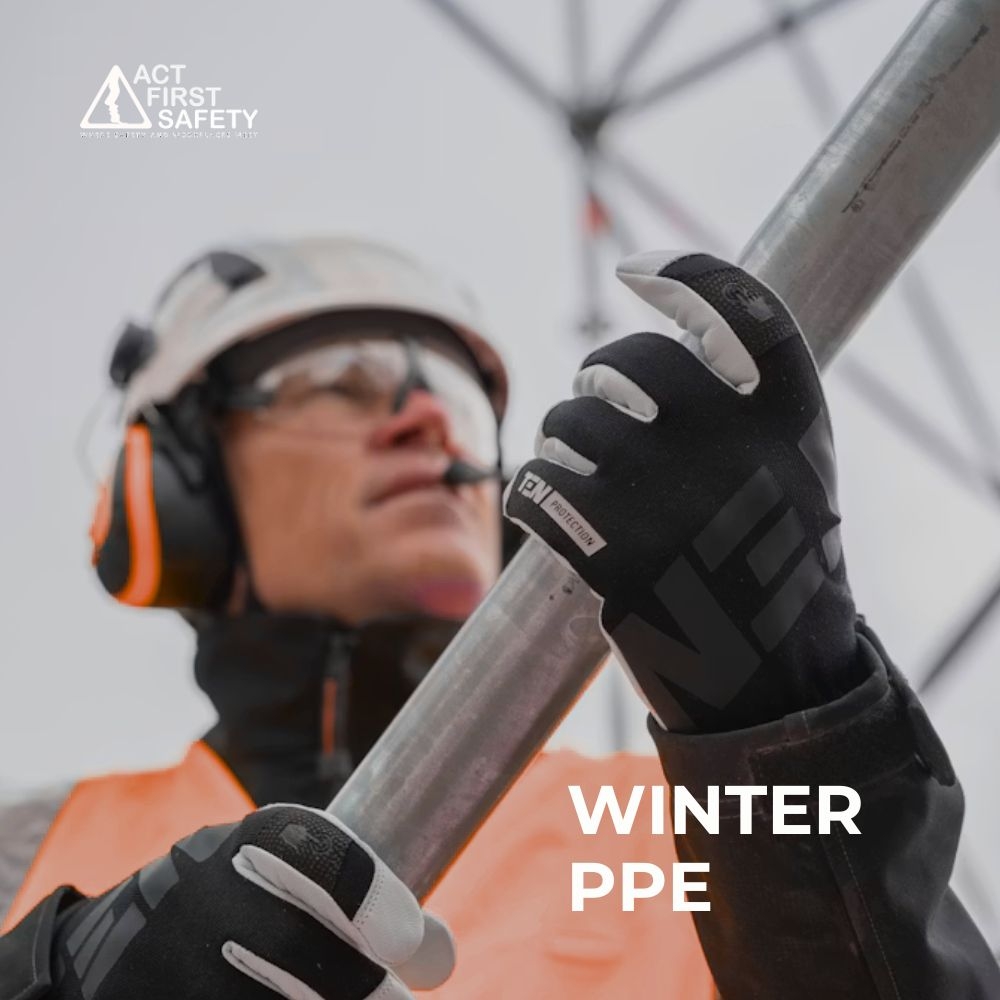 Worker wearing winter personal protective equipment for cold weather workplace safety.